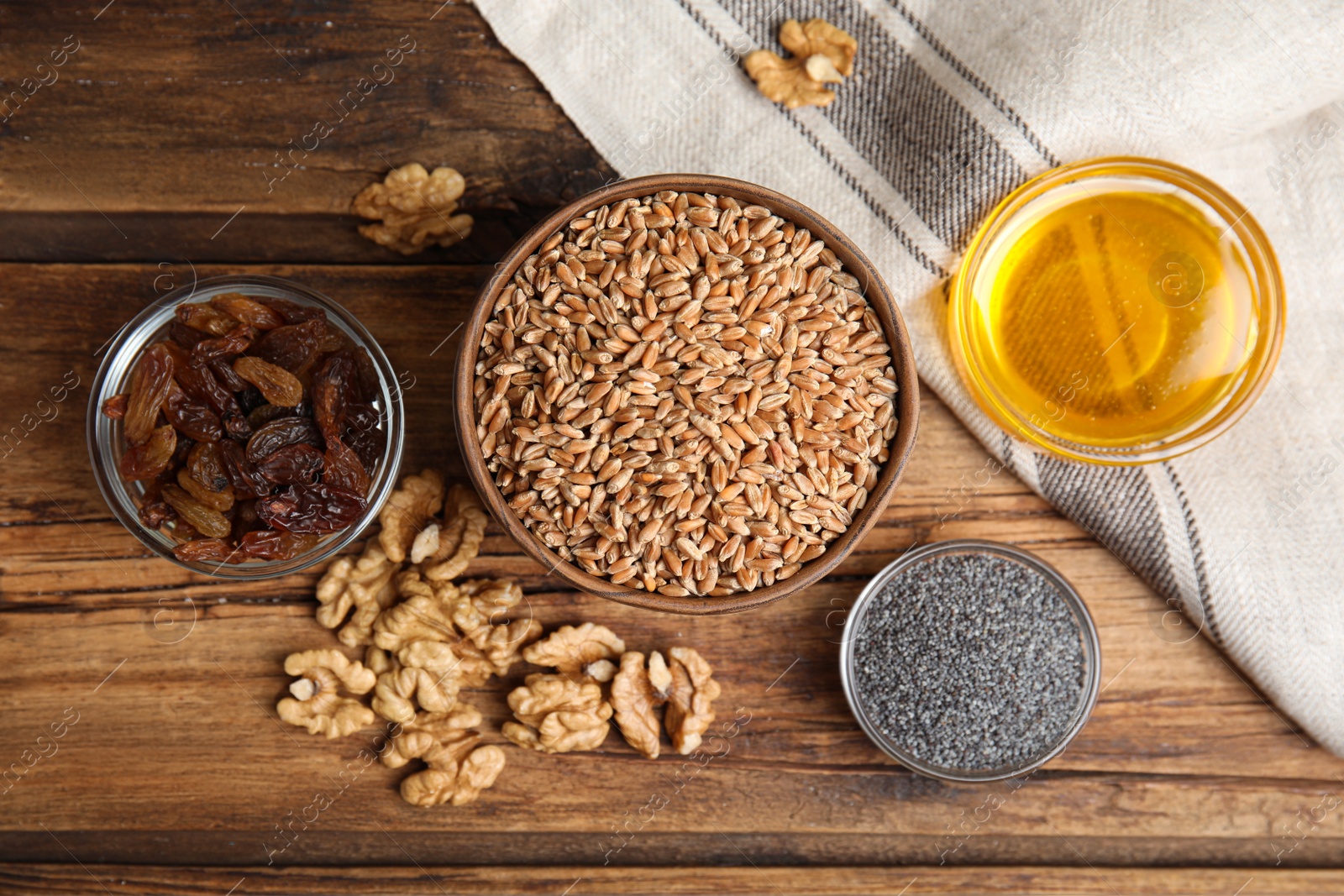 Photo of Ingredients for traditional kutia on wooden table, flat lay