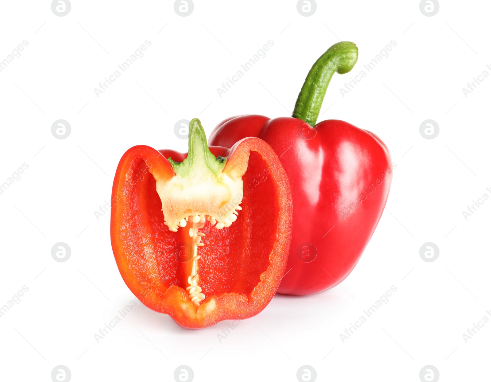 Photo of Cut and whole ripe red bell peppers on white background