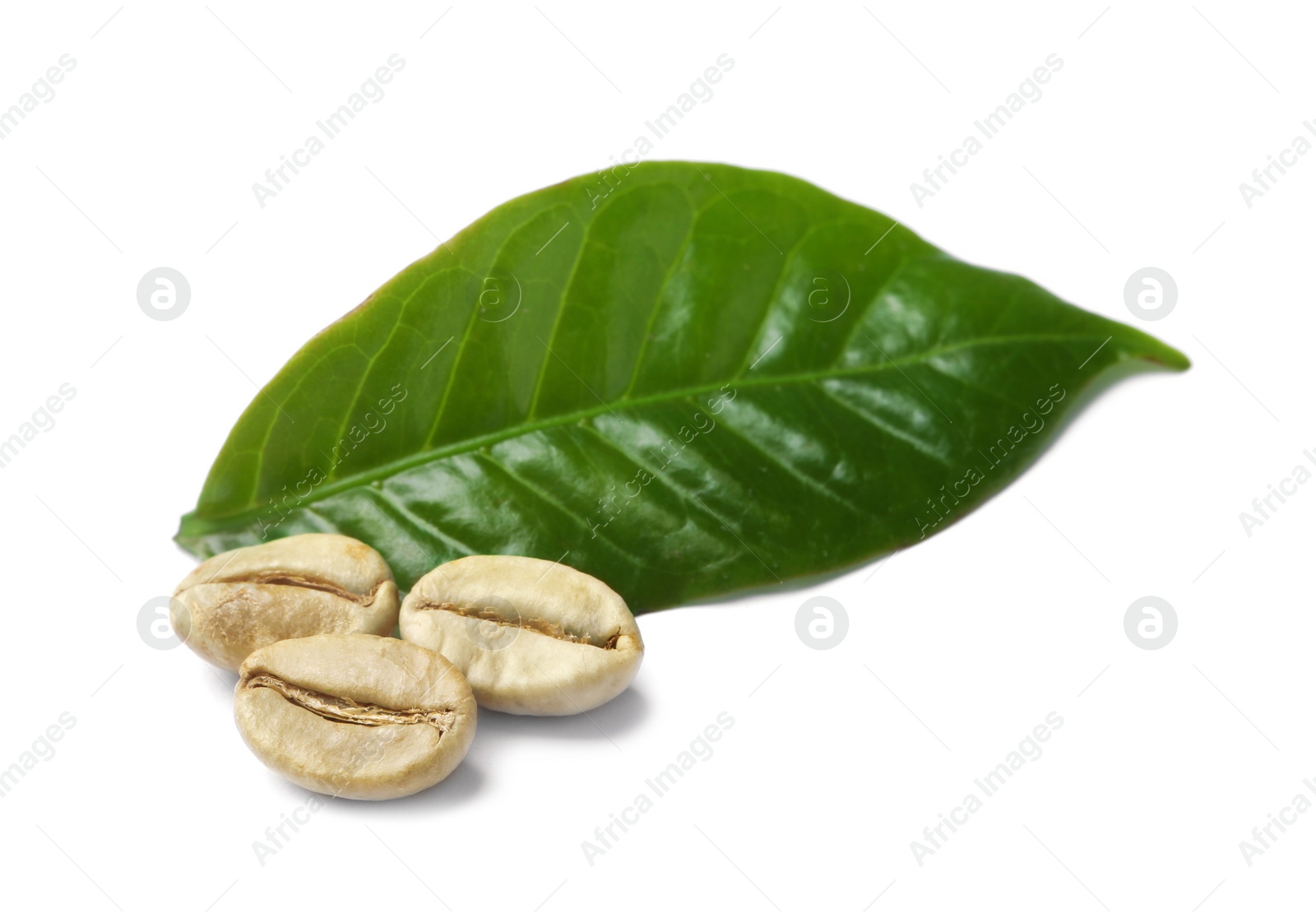 Photo of Green coffee beans and fresh leaf on white background