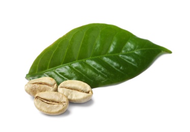 Photo of Green coffee beans and fresh leaf on white background