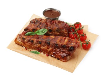 Photo of Tasty roasted pork ribs, sauce, basil and tomatoes isolated on white,
