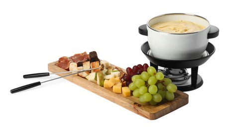 Photo of Fondue with tasty melted cheese, forks and different snacks isolated on white