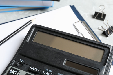 Photo of Calculator and stationery on table, closeup. Tax accounting