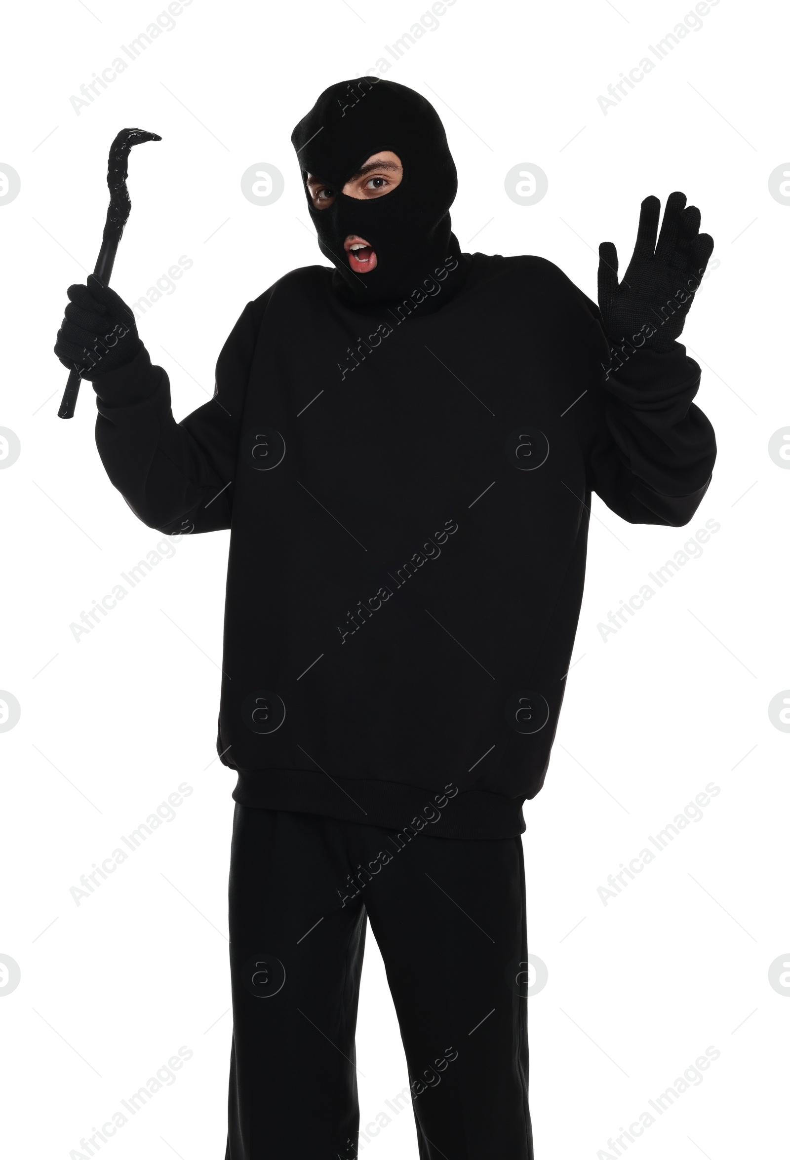 Photo of Emotional thief in balaclava with crowbar raising hands on white background