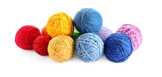 Photo of Soft colorful woolen yarns on white background