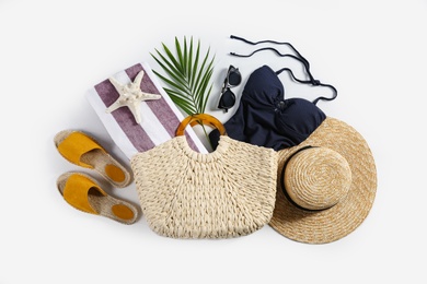 Composition with stylish beach accessories on white background, top view