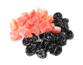 Tasty dried prunes and candied fruits on white background, top view