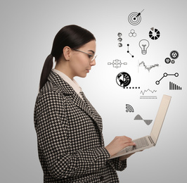 Image of Startup concept. Businesswoman with laptop on light background