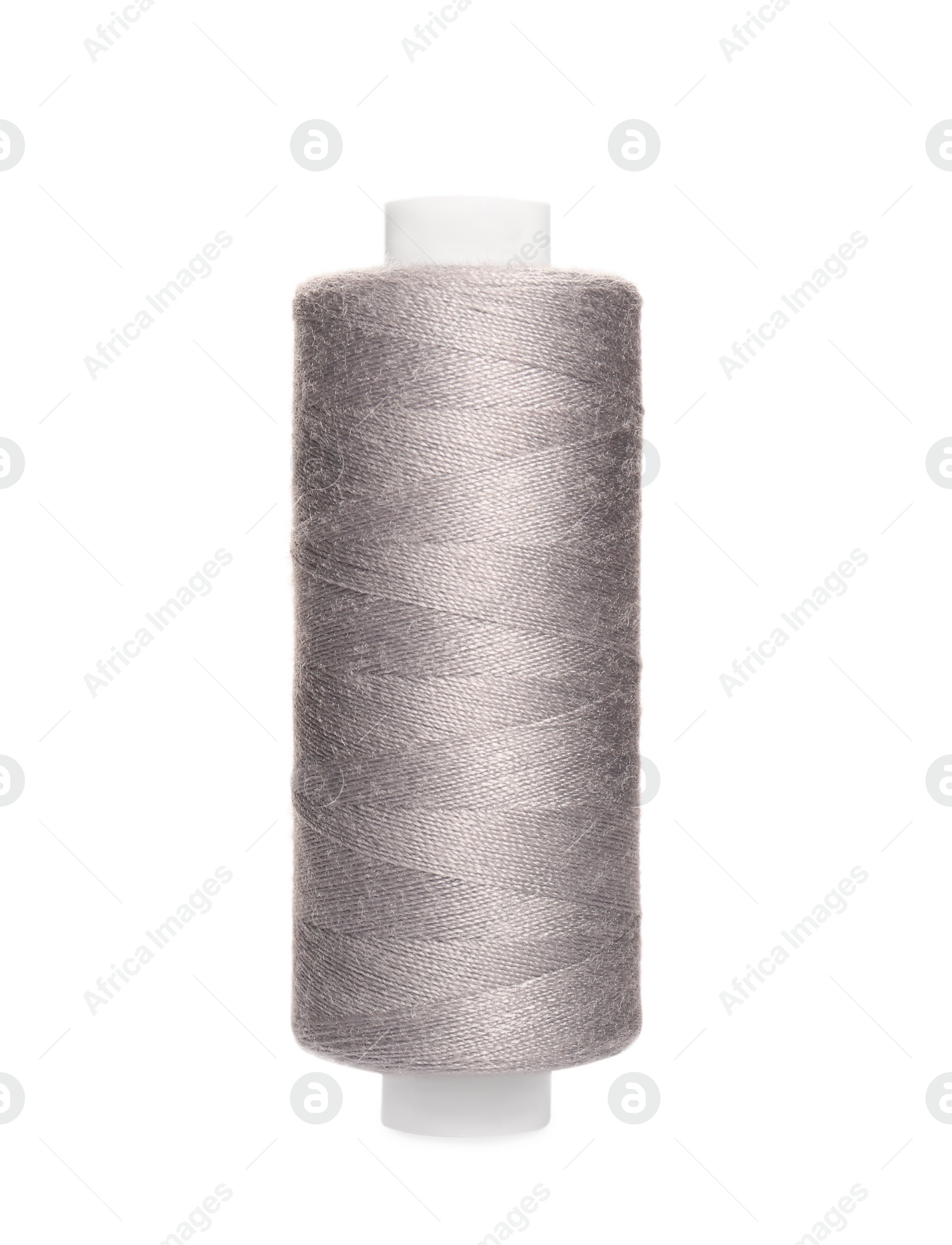 Photo of Spool of light grey sewing thread isolated on white