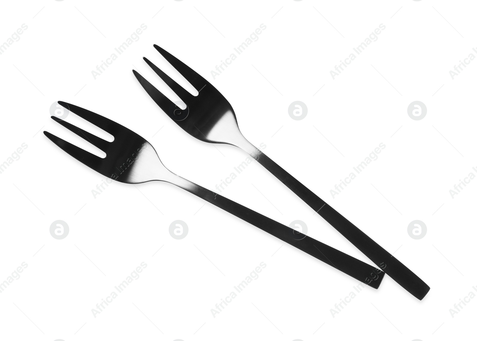 Photo of New black dessert forks on white background, top view