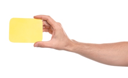 Man holding yellow card on white background, closeup of hand