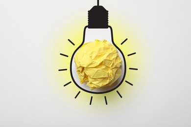 Image of Idea. Illustration of light bulb around crumpled paper ball on white background, top view