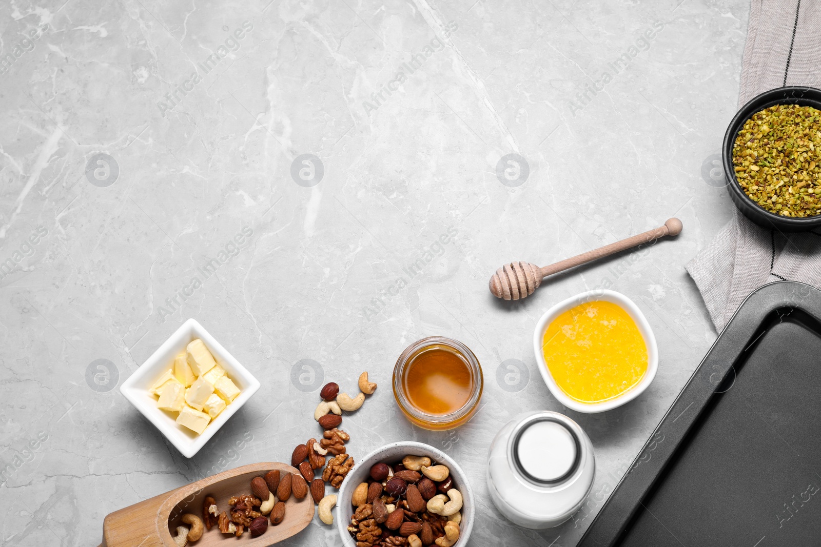 Photo of Ingredients for making delicious baklava on grey textured table, flat lay. Space for text