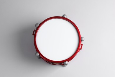 Photo of Drum on light background, top view. Percussion musical instrument