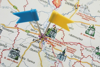 MYKOLAIV, UKRAINE - NOVEMBER 09, 2020: Kyiv city marked with push pins on map of Ukraine, closeup