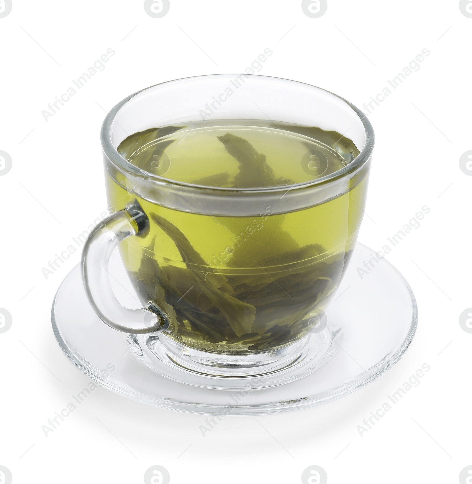 Photo of Fresh green tea in glass cup, leaves and saucer isolated on white