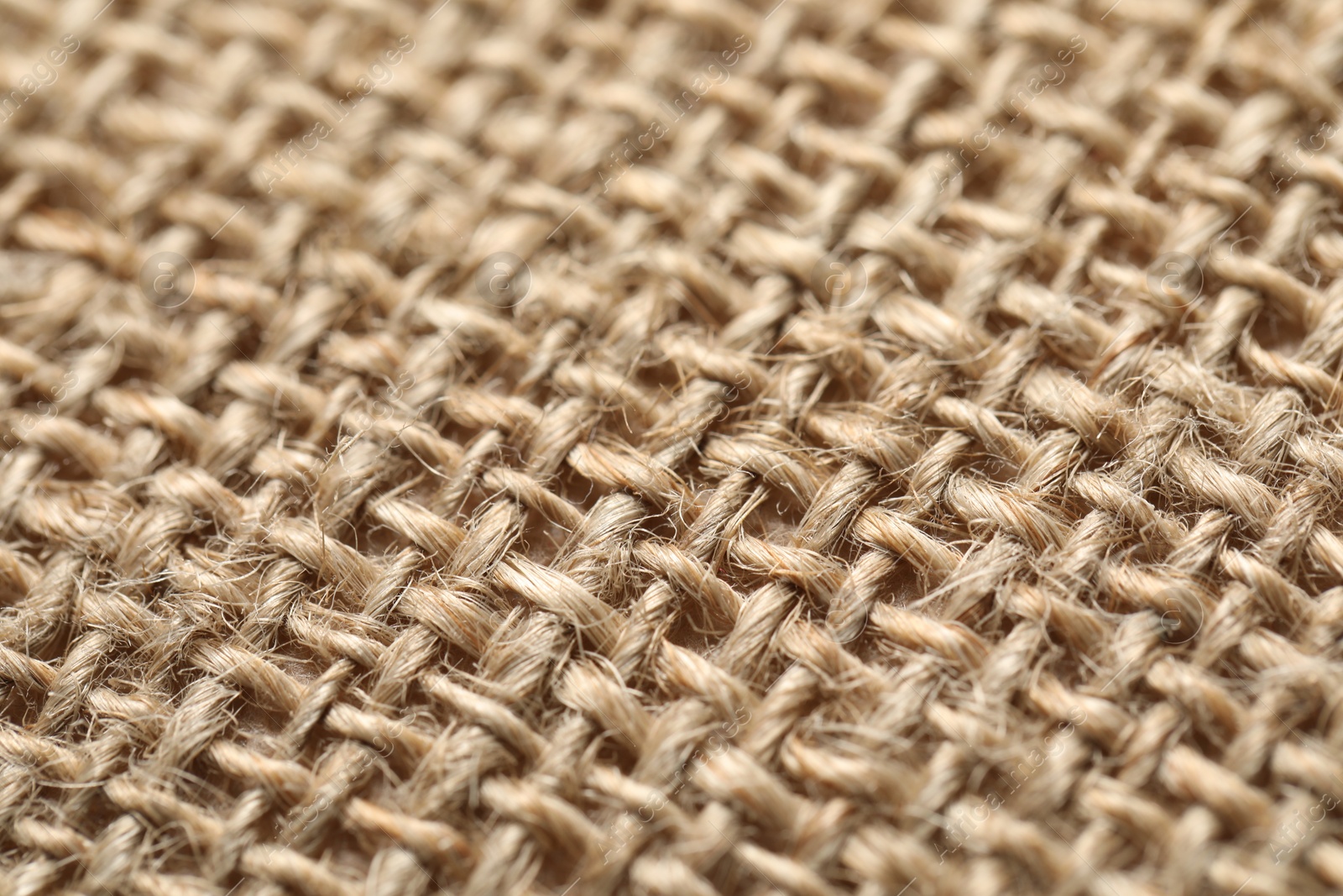 Photo of Texture of beige fabric as background, closeup