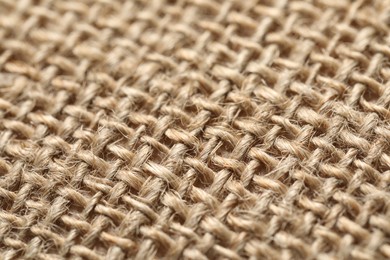 Photo of Texture of beige fabric as background, closeup