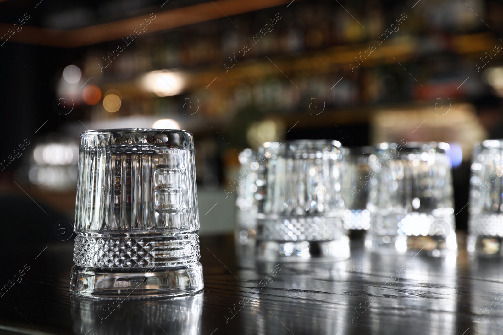 Photo of Empty clean glass on counter in bar. Space for text