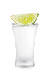 Photo of Shot glass of vodka and lime isolated on white