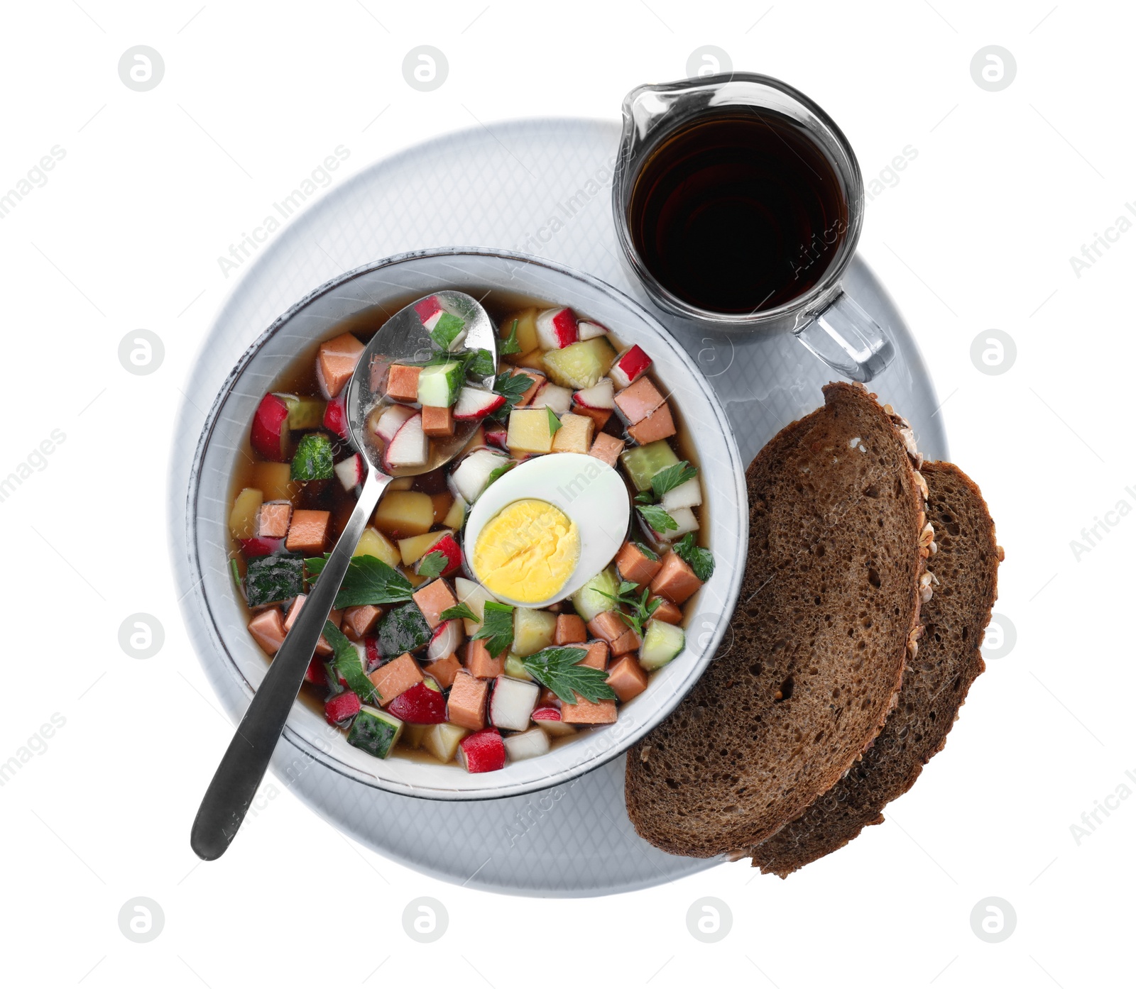 Photo of Delicious cold okroshka with kvass isolated on white, top view. Traditional Russian summer soup