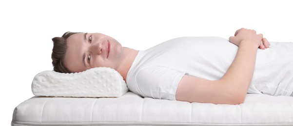 Photo of Man lying on orthopedic pillow against white background