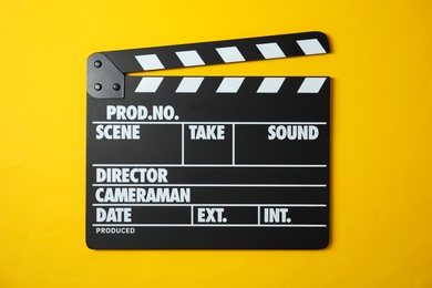 Clapperboard on color background, top view. Cinema production