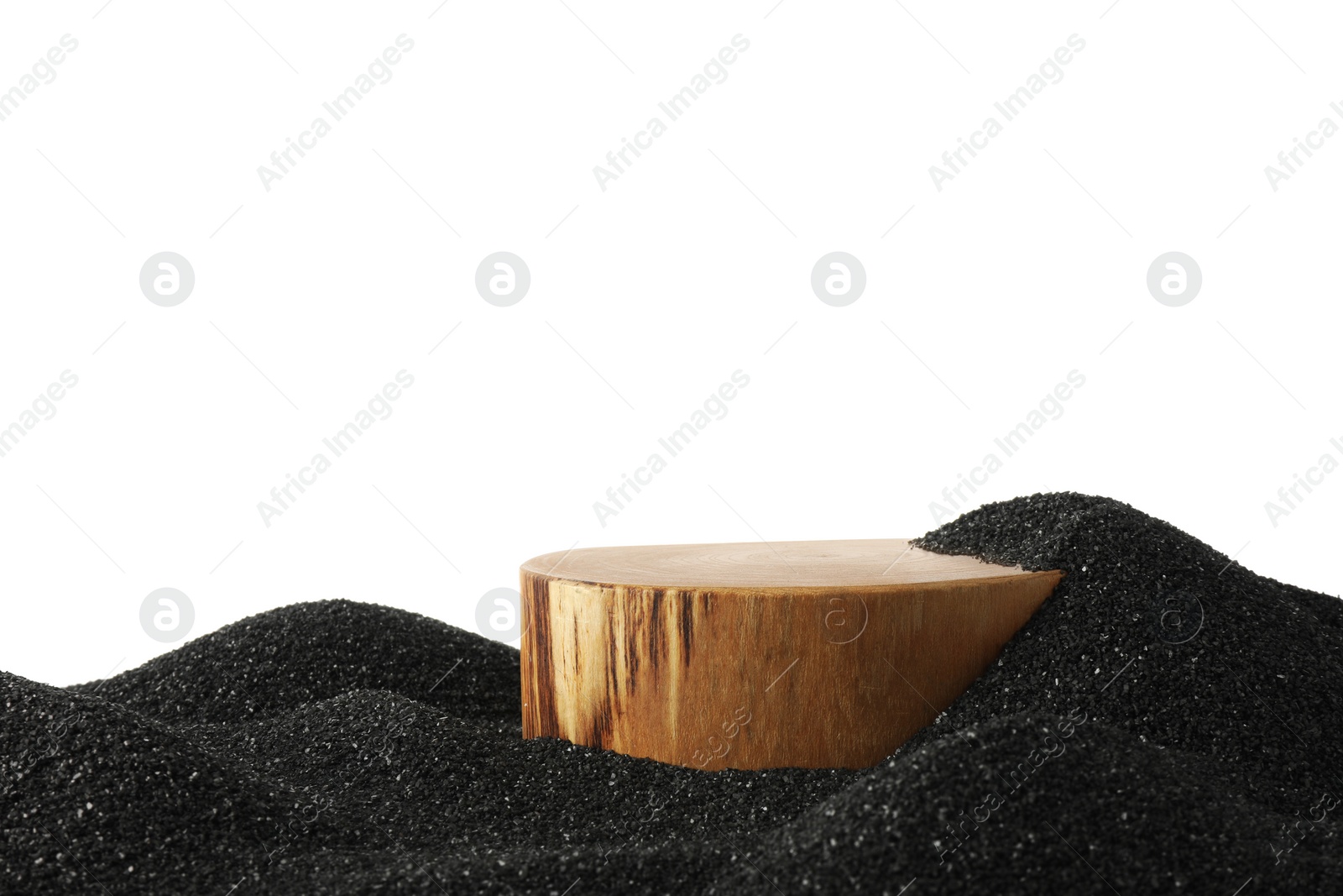 Photo of Presentation of product. Wooden podium on black sand against white background