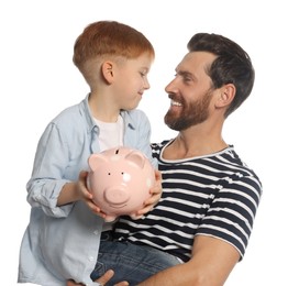 Photo of Father and his son with ceramic piggy bank on white background