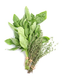 Fresh green basil and thyme on white background, top view. Aromatic herbs