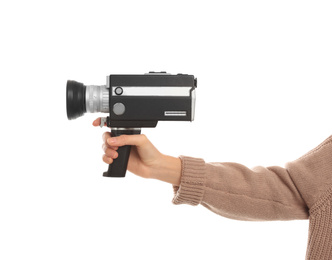 Woman with vintage video camera on white background, closeup of hand