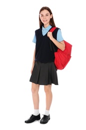 Photo of Full length portrait of teenage girl in school uniform with backpack on white background