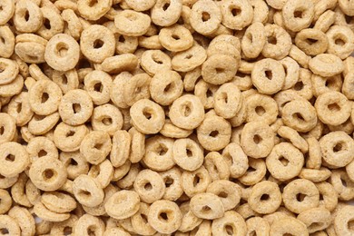Photo of Sweet tasty corn rings as background, top view
