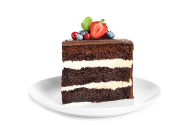 Plate with slice of chocolate sponge berry cake on white background