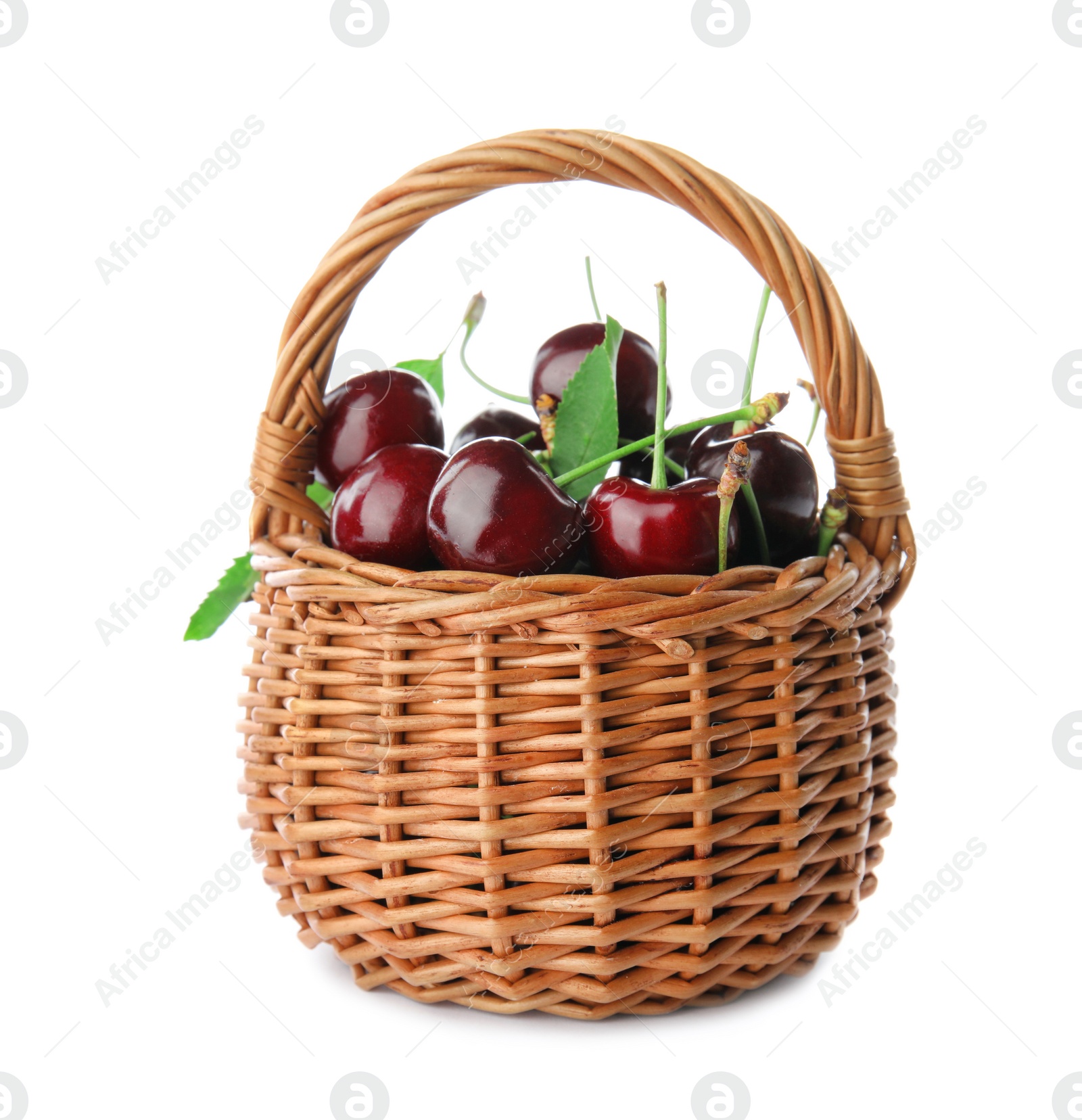 Photo of Wicker basket with sweet red cherries on white background