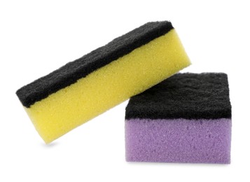 Photo of Bright cleaning sponges with abrasive scourers on white background