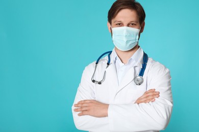 Doctor or medical assistant (male nurse) with protective mask and stethoscope on turquoise background. Space for text