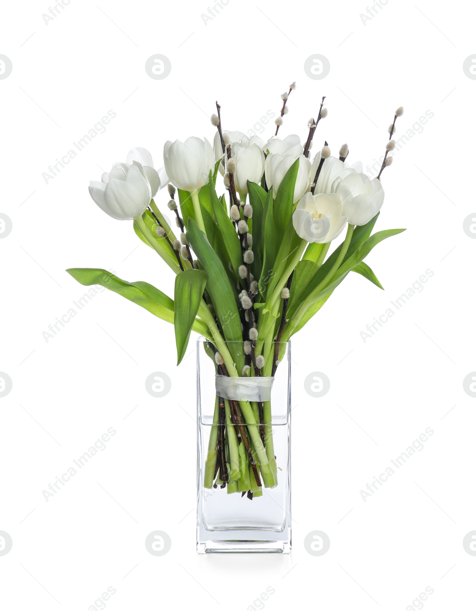 Photo of Beautiful bouquet of willow branches and tulips in vase isolated on white