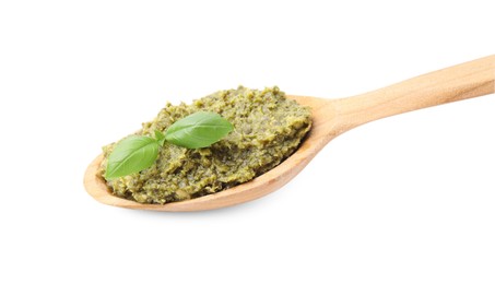 Wooden spoon with delicious pesto sauce and basil isolated on white