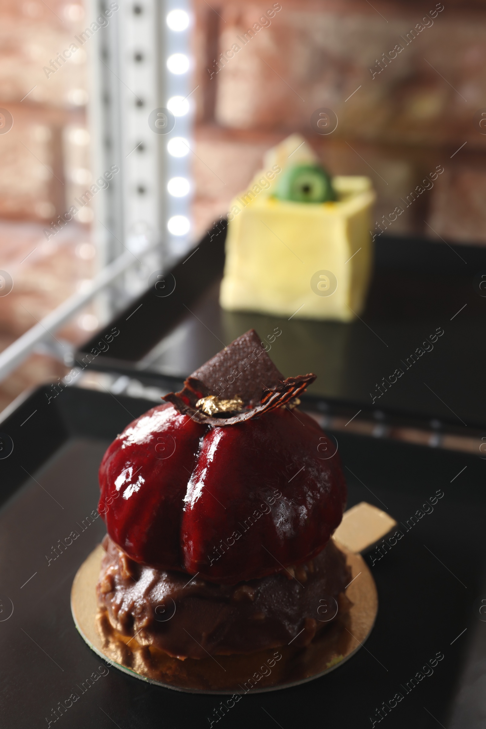 Photo of Delicious nutty dessert with chocolate on plate, closeup. Space for text