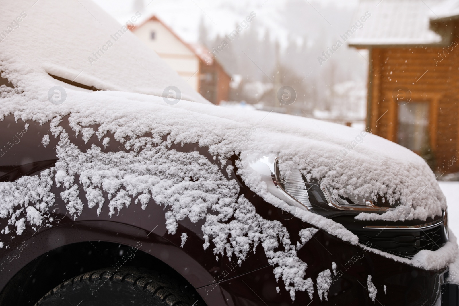 Photo of Car covered with snow after storm outdoors on beautiful winter day, closeup