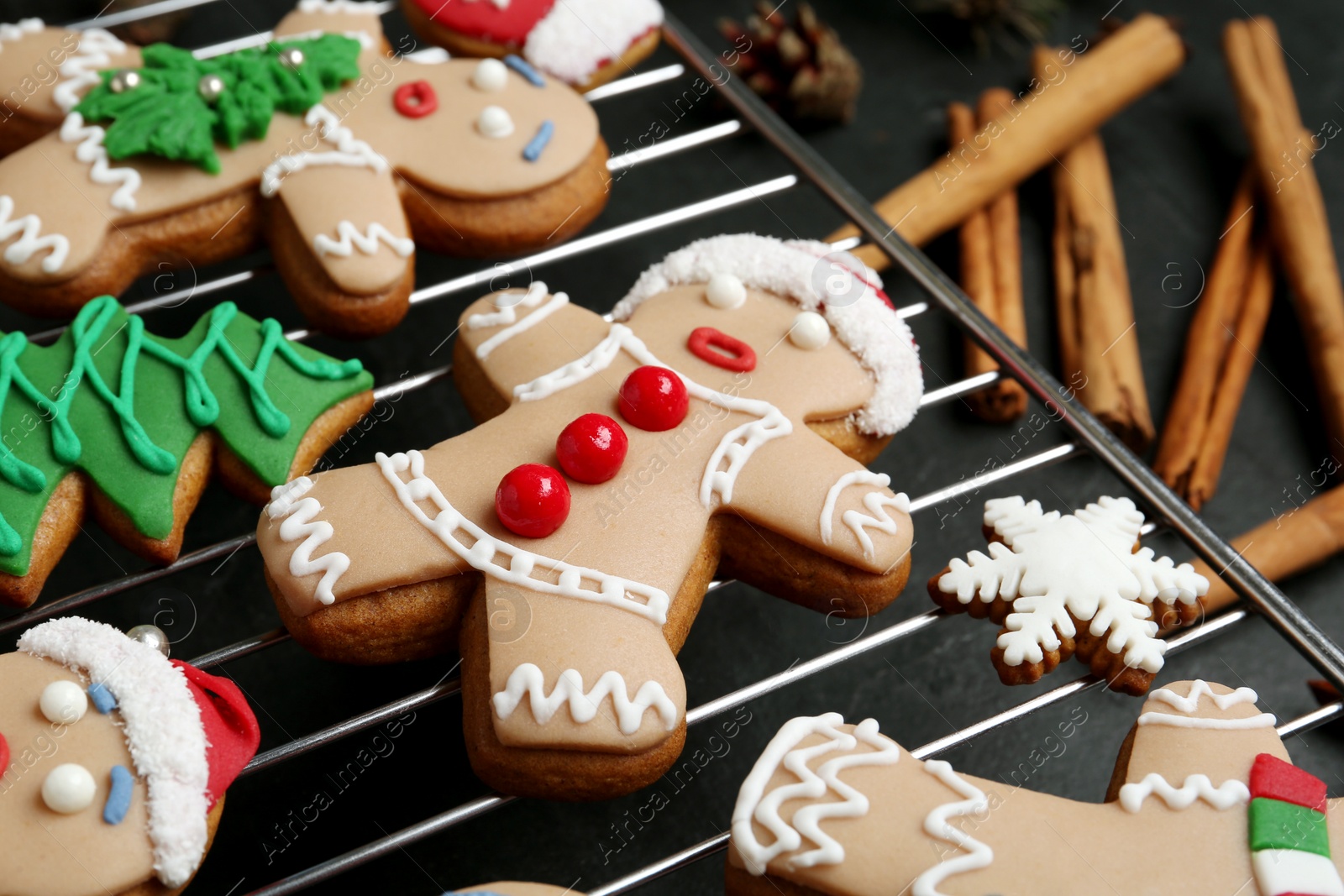 Photo of Delicious Christmas cookies on black table, closeup