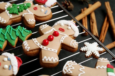 Delicious Christmas cookies on black table, closeup