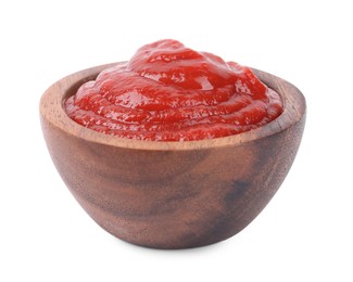 Organic ketchup in wooden bowl isolated on white. Tomato sauce