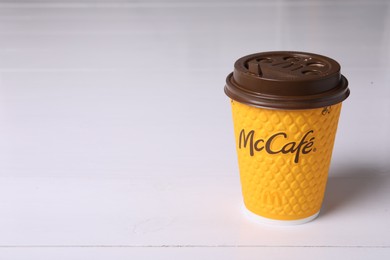 Photo of MYKOLAIV, UKRAINE - AUGUST 12, 2021: Hot McDonald's drink on light background. Space for text