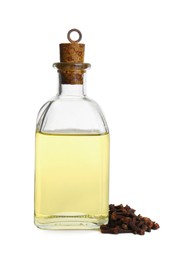 Photo of Essential oil and dried cloves on white background
