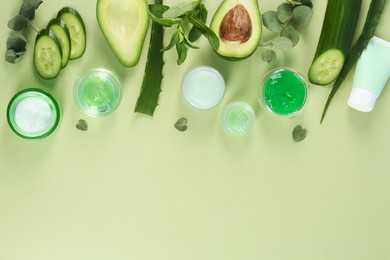Photo of Flat lay composition with homemade cosmetic products and fresh ingredients on light green background, space for text. DIY beauty recipe