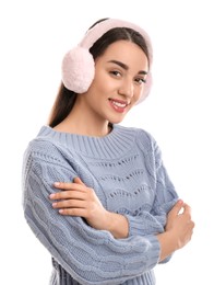Photo of Beautiful young woman wearing earmuffs on white background