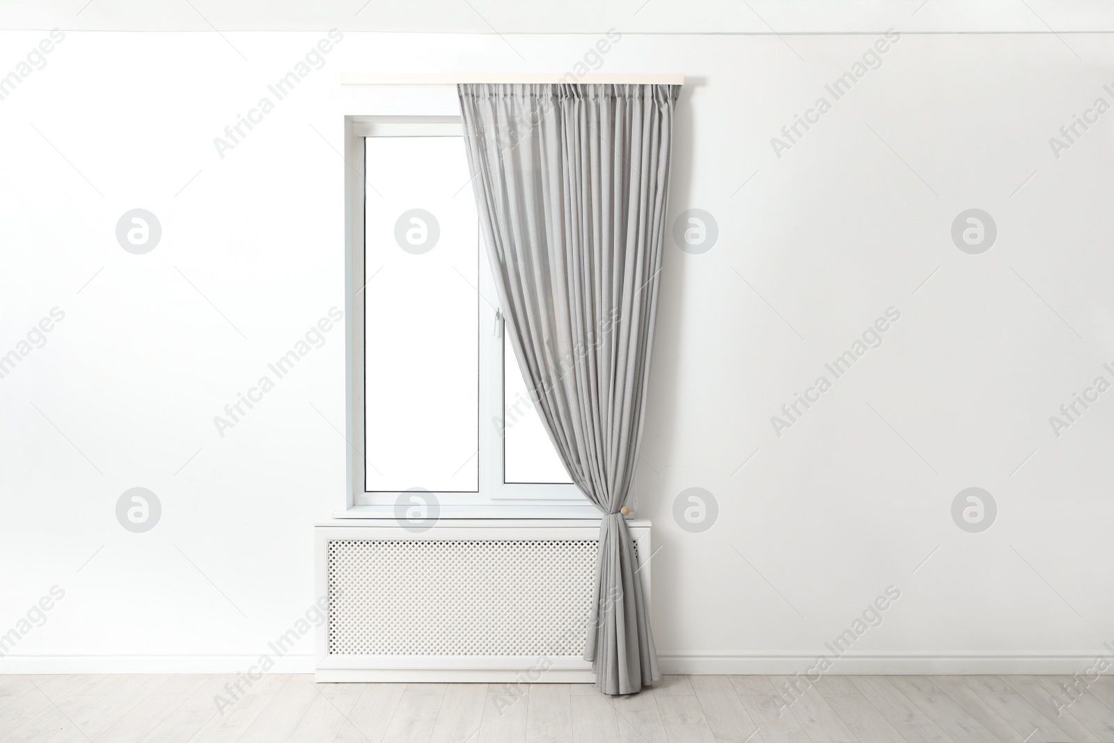 Photo of Modern window with beautiful curtains in room
