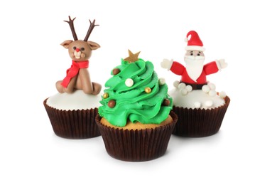 Photo of Different beautiful Christmas cupcakes on white background